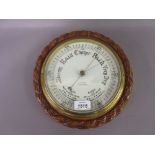 Large late 19th / early 20th Century circular carved oak aneroid barometer with a rope pattern case