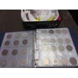 Album containing a collection of World coins together with a quantity of loose coins