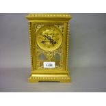 Small 19th Century matt gilded brass four glass library clock with knopped baluster corner