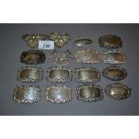 Group of ten various rectangular silver decanter labels together with a pair of oval silver