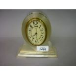 Continental silver (900 mark) mantel or dressing table clock of Art Deco design with an oval dial,