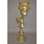 Mid 20th Century metal table lamp in the form of a cherub supporting a torch