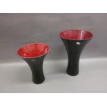 Two modern Polish black and red glass waisted form vases