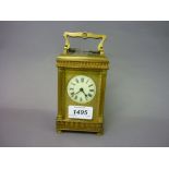 Small late 19th Century ornate brass cased carriage clock with reeded corner pilasters,