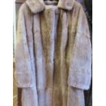 Ladies musquash full length fur coat together with a mink stole,