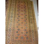 Small Afghan gold ground rug with a single central floral panel and multiple borders,