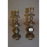 Pair of late 19th Century Japanese dark patinated bronze candlesticks