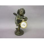Small 19th Century French dark patinated and gilt bronze mantel clock in the form of a cherub