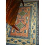 Modern Turkish rug with a twin hooked medallion design on a rose ground with border,