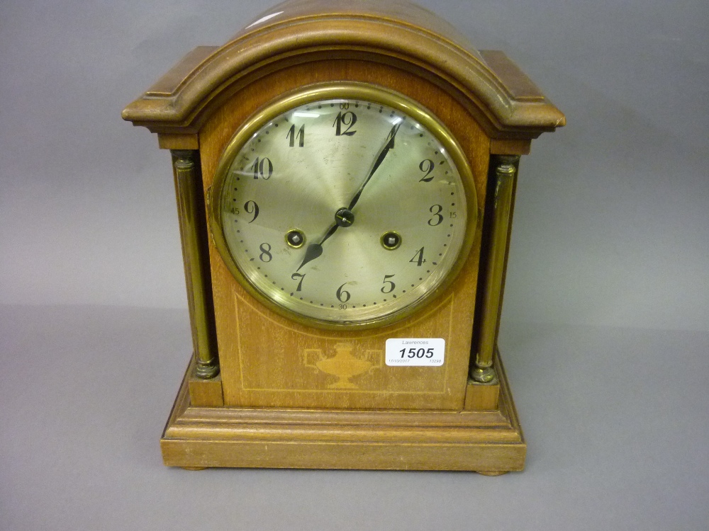 Edwardian mahogany and inlaid mantel clock with brass corner pilasters, silvered dial,