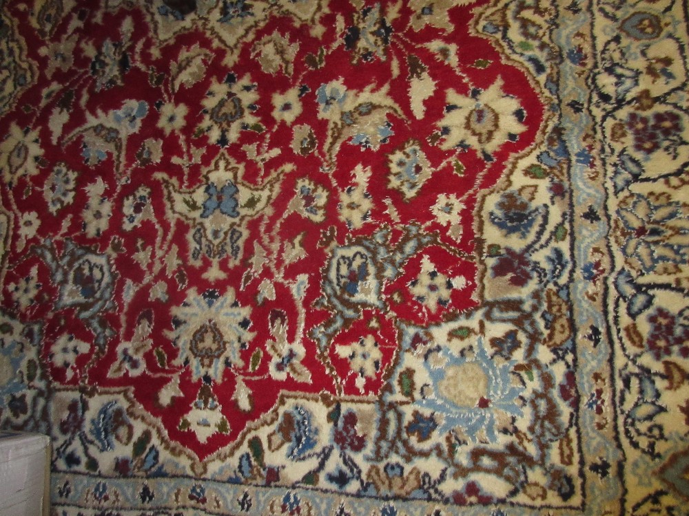 Indo Persian rug with a centre medallion and all-over floral design with borders,