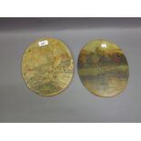 Two oval terracotta plaques painted with a snowy street scene and a landscape with cattle