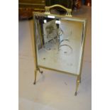 Art Nouveau brass fire screen with an inset bevelled mirror panel