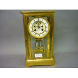 19th Century matt gilded four glass library clock, the enamel dial with Roman numerals,