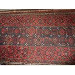 Two Belouch rugs on wine ground,