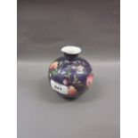 Small 20th Century Chinese porcelain vase decorated with flowers and fruits on a blue ground,
