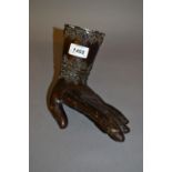 Dark patinated bronze sculpture of a hand