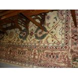 Large Turkey carpet with all-over stylised floral design in pale shades with borders,