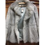 Ladies light coloured short fur jacket