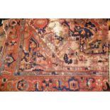 Small Indian carpet with a large lobed medallion design on an ivory ground with rust borders (much