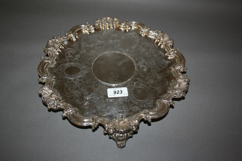 Victorian silver salver, the scroll and shell rim enclosing an engraved centre panel,