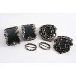 A PAIR OF GEORGE III / IV SMALL CUT-STEEL SHOE BUCKLES with black leather centres and blued steel,