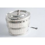 A GEORGE II OVAL TEA CADDY Decorated around the sides with reeded hoops and staves to resemble