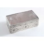 AN EARLY 20TH CENTURY RECTANGULAR BOX with an agate-set base & cover and chased leaves & berries