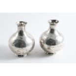 A PAIR OF EARLY 20TH CENTURY CHINESE SMALL BOTTLE VASES on circular collet bases, maker's mark "