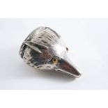 A VICTORIAN NOVELTY PLATED SNUFF BOX Modelled as a fox mask with coloured glass eyes and an engine-