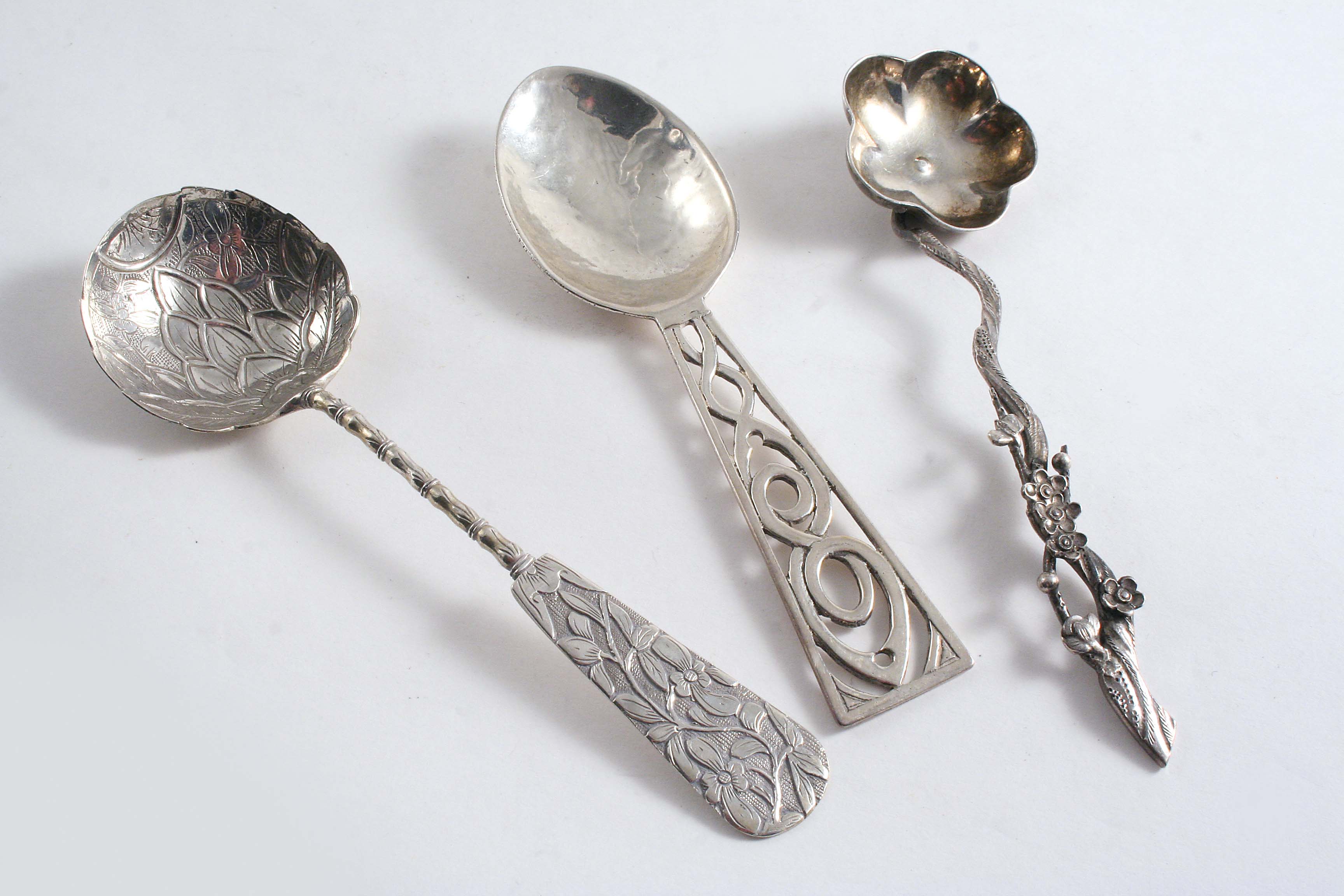 A SMALL HANDMADE SPOON with an openwork stem, by Amy Sondheim, London 1935 and two Chinese spoons;