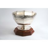 A MODERN OCTAGONAL ROSE BOWL with a pierced gallery, a low foot and a wooden plinth, by Roberts &