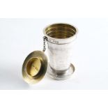 A LATE VICTORIAN COLLAPSIBLE TRAVELLING BEAKER the cover attached by a chain, gilt interior, by
