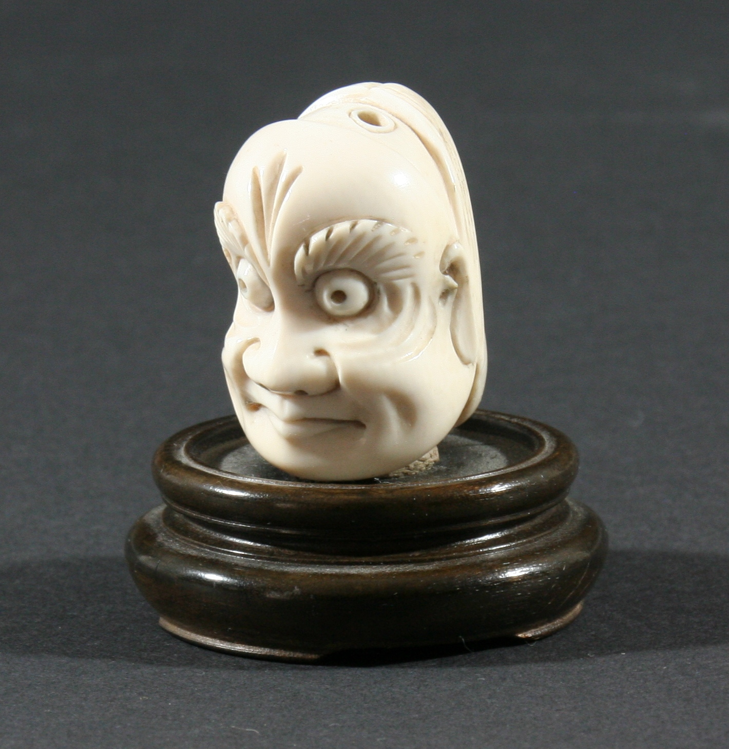 TWO JAPANESE NETSUKE, the first of a man standing with a box hung from his neck, height 5.2cm, - Image 3 of 5