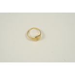 AN 18CT. GOLD SIGNET RING engraved with initials, 4.2 grams. Size L.