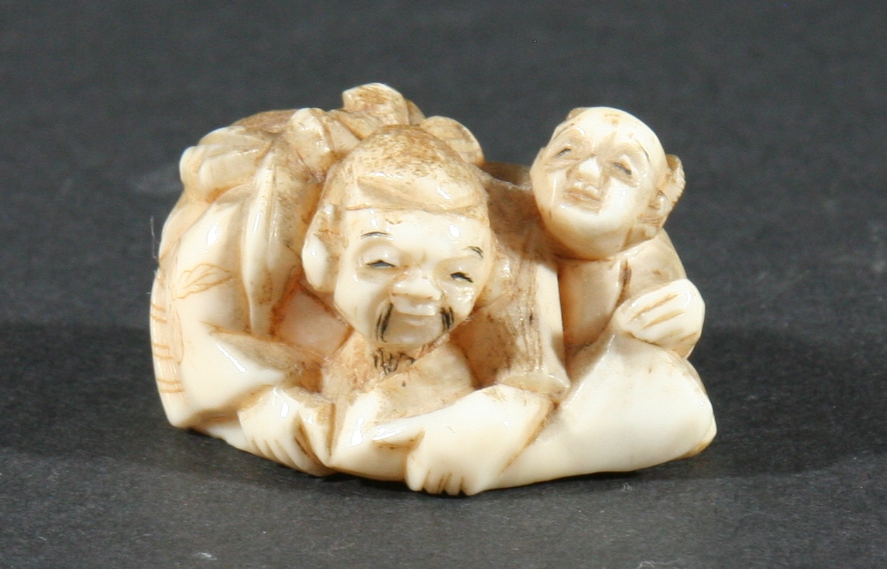 FOUR JAPANESE IVORY NETSUKE, the first carved as a grinning mask, height 4.3cm, together with a - Image 3 of 6