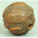 JAPANESE WOODEN NETSUKE OF MAN IN A BASKET, inset ivory plaque signed Hopee, length 3.5cm;