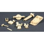 JAPANESE IVORY AUTOMATON, modelled as figures at a work bench, in pieces, together with an ivory