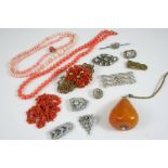 A QUANTITY OF JEWELLERY including a coral necklace, a paste set naval crown brooch, and various