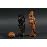 JAPANESE HARDWOOD NETSUKE, carved as a grimacing face, signed, 4cm; together with two hardwood