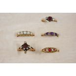 AN AMETHYST AND DIAMOND RING the three oval-shaped amethysts are set with rose-cut diamonds, in
