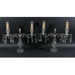 PAIR OF TWO LIGHT GLASS CANDELABRA the silver plated arms supporting floral drip trays, on reeded