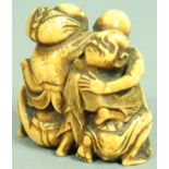 JAPANESE IVORY NETSUKE OF A MELEE OF MEN, all climbing over each other, height 4cm