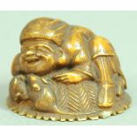 JAPANESE IVORY NETSUKE OF A MAN AND RATS, resting on a basket, signature, diameter 3.5cm; together