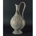 QAJAR COPPER EWER, Persian, 19th Century, of flattened baluster form decorated in relief with