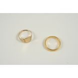 A 9CT. GOLD SIGNET RING 1.5 grams., size K, together with a 22ct. gold wedding band, 4.4 grams, size