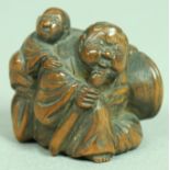 JAPANESE WOODEN NETSUKE OF TWO OTTERS, signed, 2.8cm; together with another of man carrying a child,
