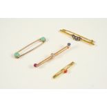 A GOLD AND GEM SET BROOCH the gold bar brooch is centred with an old brilliant-cut diamond, with