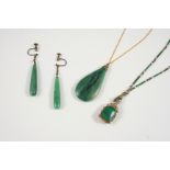AN PEAR-SHAPED JADE PENDANT 4.5cm. long, together with a pair of jade drop earrings and a