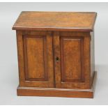 VICTORIAN WALNUT STATIONERY CABINET, the pair of fielded panel doors enclosing a fitted interior,